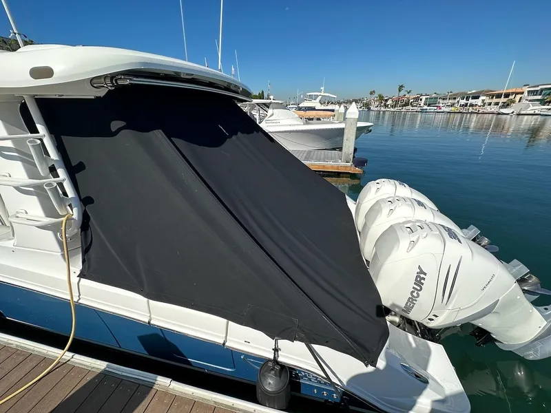 Slide: The Image of 2019 Boston Whaler 350 Realm with Mercury engines docked at marina. - 46