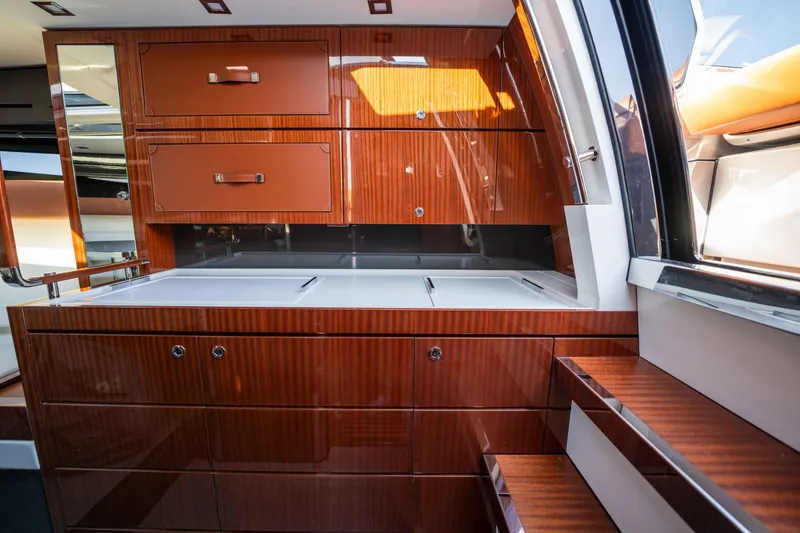Slide: The Image of Luxurious interior of 2024 Riva 38 Rivamare yacht with polished wood cabinetry. - 18