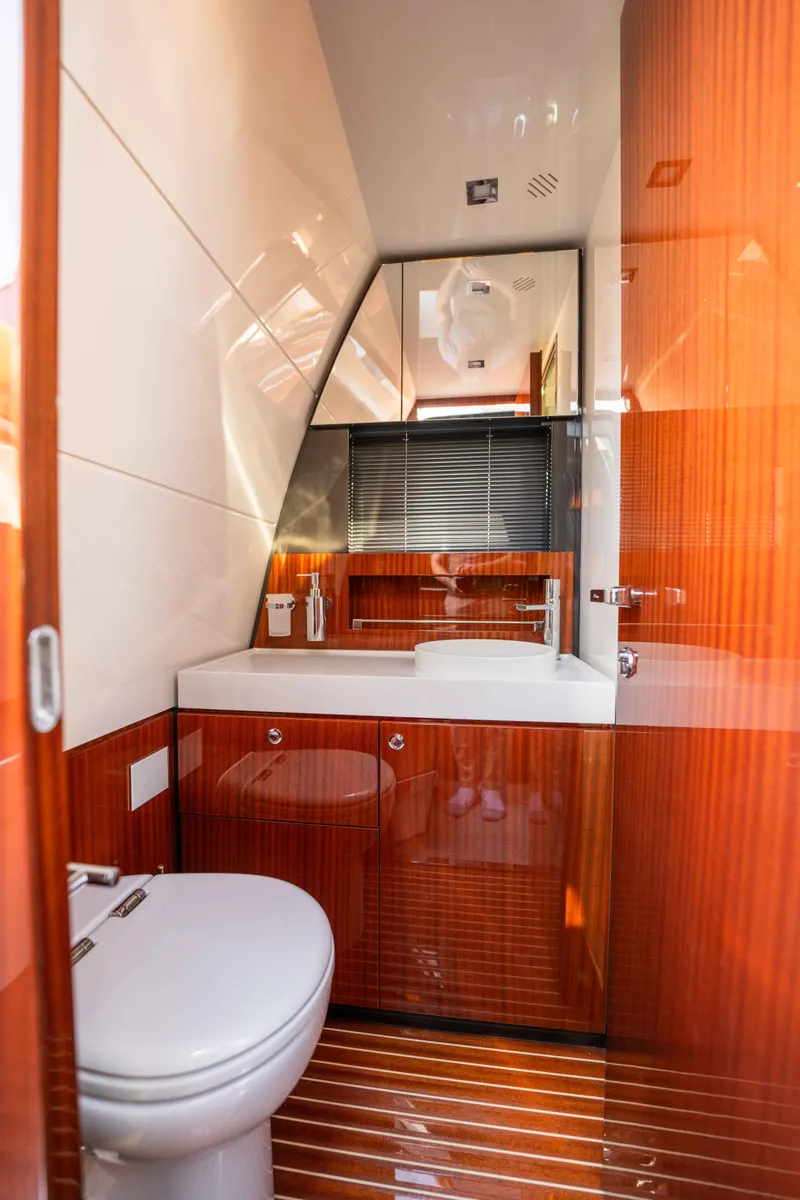 Slide: The Image of Luxurious bathroom in 2024 Riva 38 Rivamare yacht with sleek wood finishes. - 19