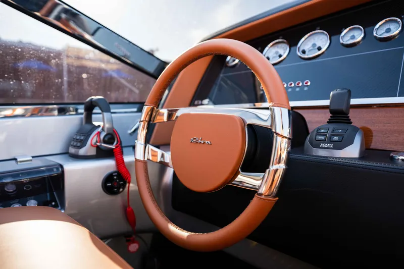 Slide: The Image of 2024 Riva 38 Rivamare yacht cockpit with luxurious leather steering wheel and modern dashboard. - 20
