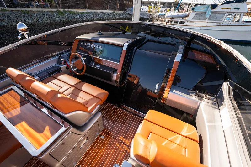 Slide: The Image of 2024 Riva 38 Rivamare luxury yacht interior with sleek design and leather seating. - 22