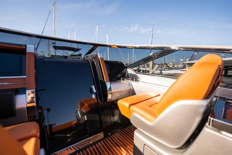 Slide: The Image of 2024 Riva 38 Rivamare yacht with sleek design and luxurious orange seating. - 24