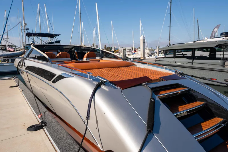 Slide: The Image of 2024 Riva 38 Rivamare luxury yacht docked at marina, showcasing sleek design and elegance. - 32