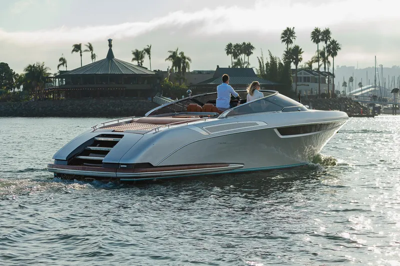 Slide: The Image of 2024 Riva 38 Rivamare luxury yacht cruising on a scenic waterway. - 9