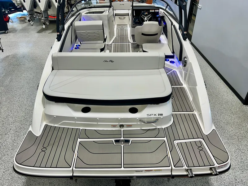 Slide: The Image of 2025 Sea Ray SPX 210 boat interior with sleek design and modern features. - 13