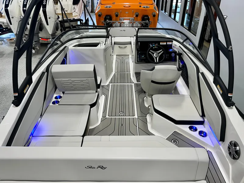 Slide: The Image of 2025 Sea Ray SPX 210 boat interior with modern seating and sleek design. - 14