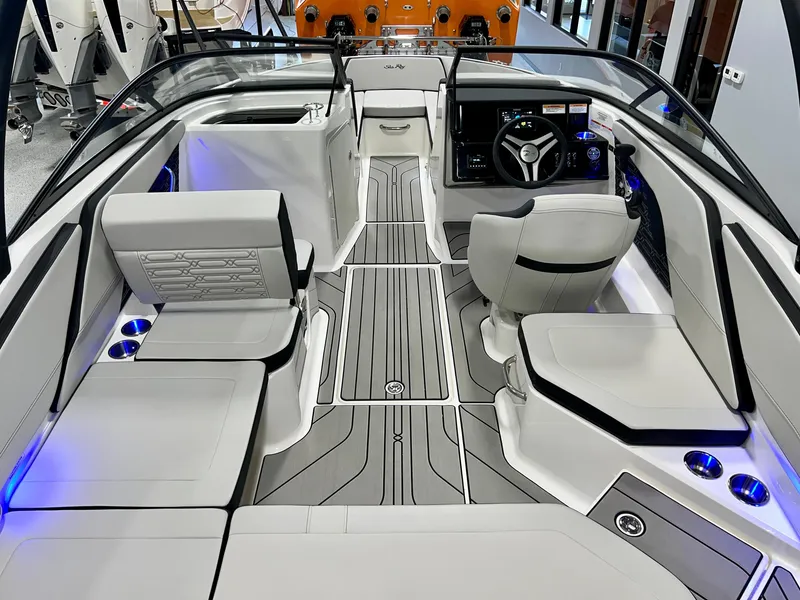 Slide: The Image of 2025 Sea Ray SPX 210 boat interior with modern seating and sleek design. - 15