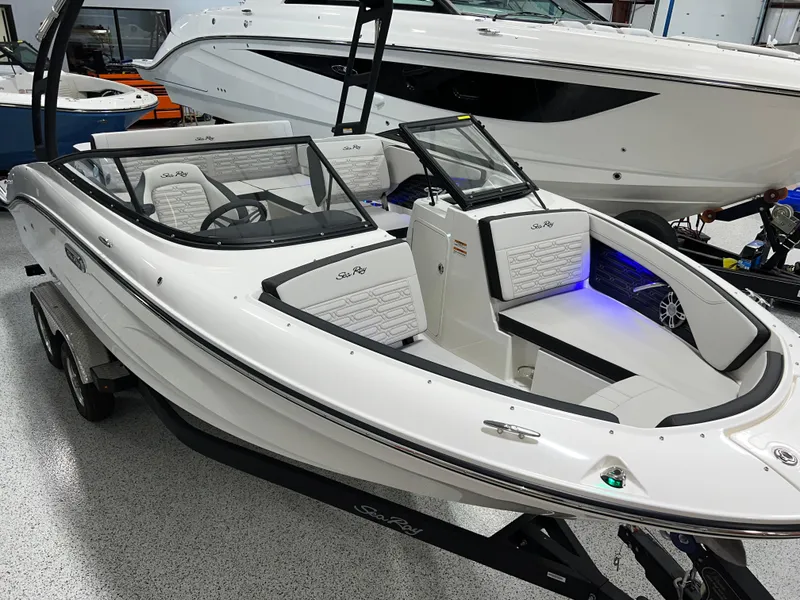 Slide: The Image of 2025 Sea Ray SPX 210 boat with sleek design, white exterior, and modern interior features. - 2