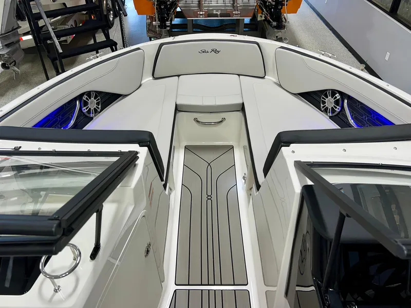 Slide: The Image of 2025 Sea Ray SPX 210 boat interior with sleek seating and modern design. - 28