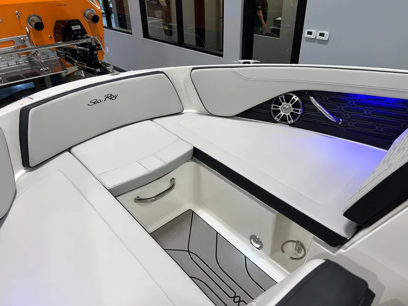 Slide: The Image of 2025 Sea Ray SPX 210 boat interior with white seating and modern design. - 30