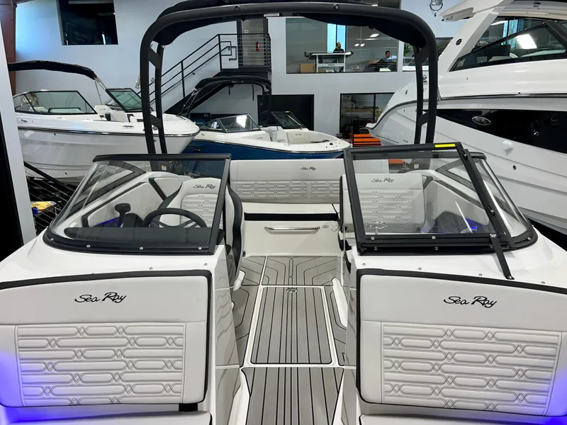 Slide: The Image of 2025 Sea Ray SPX 210 boat interior with modern design and seating. - 33