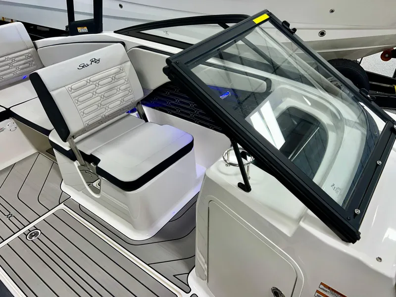 Slide: The Image of 2025 Sea Ray SPX 210 boat interior with seating and windshield. - 38