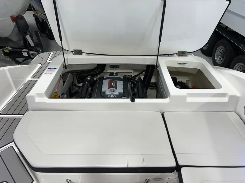 Slide: The Image of 2025 Sea Ray SPX 210 boat engine compartment with open hatch. - 43
