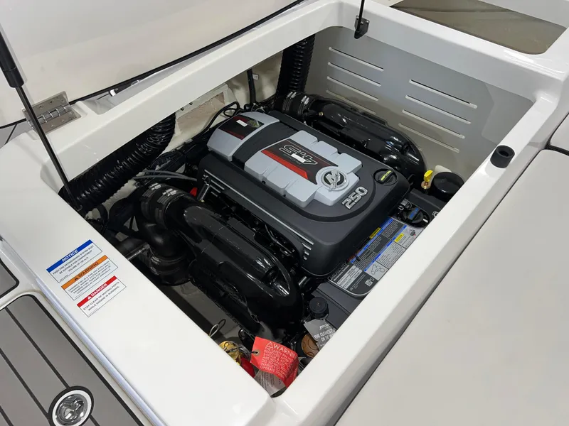 Slide: The Image of 2025 Sea Ray SPX 210 boat engine compartment, showcasing powerful marine engine. - 44