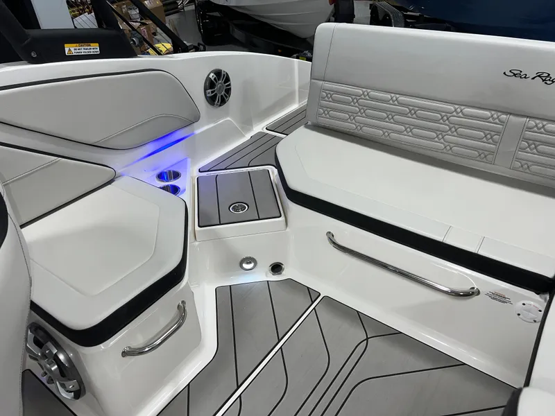 Slide: The Image of 2025 Sea Ray SPX 210 boat interior with modern seating and sleek design. - 45