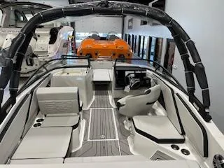 Slide: The Image of 2025 Sea Ray SPX 210 boat interior with sleek seating and modern design. - 65