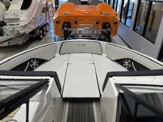 Slide: The Image of 2025 Sea Ray SPX 210 boat interior with sleek seating and modern design. - 66