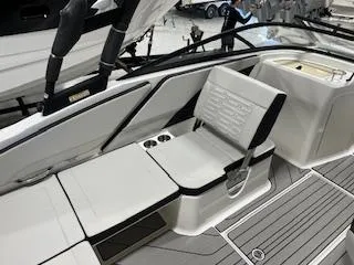 Slide: The Image of 2025 Sea Ray SPX 210 boat interior with sleek seating and modern design. - 69