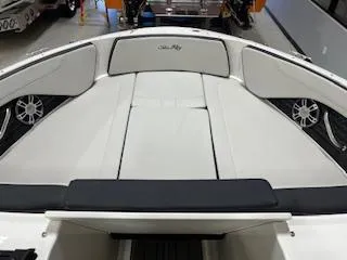 Slide: The Image of 2025 Sea Ray SPX 210 boat interior with sleek white seating and modern design. - 72