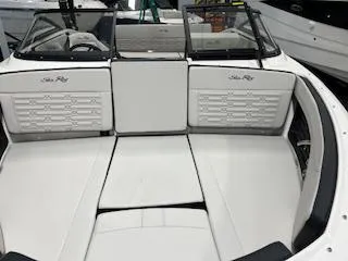 Slide: The Image of 2025 Sea Ray SPX 210 boat interior with white seating and sleek design. - 74