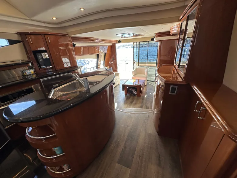 Slide: The Image of Luxurious 2004 Marquis 59 yacht interior with elegant wood finishes and modern amenities. - 23