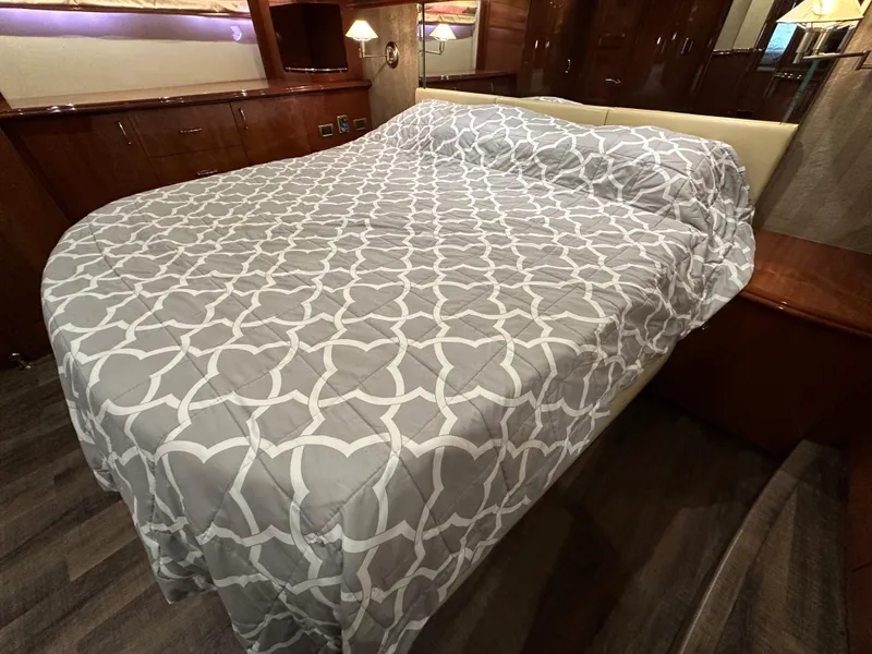 Slide: The Image of Luxurious bedroom interior of 2004 Marquis 59 yacht with elegant bedding. - 26
