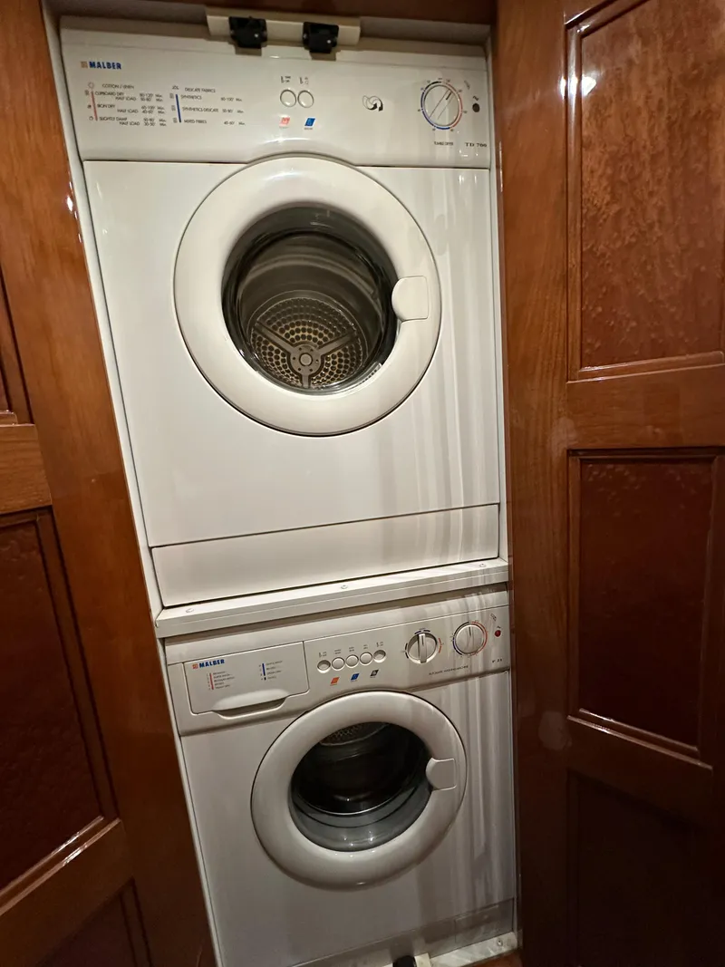 Slide: The Image of Stacked washer and dryer in 2004 Marquis 59 yacht laundry area. - 37