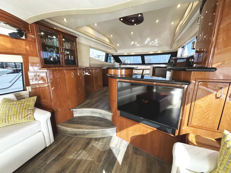 Slide: The Image of Luxurious 2004 Marquis 59 yacht interior with elegant wood finishes and modern amenities. - 6