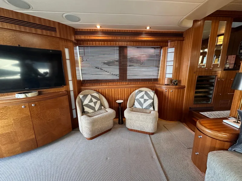 Slide: The Image of Luxurious 2007 Horizon 73 Motor Yacht interior with cozy seating and elegant wood finishes. - 13