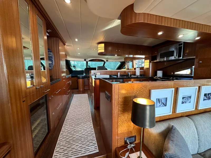 Slide: The Image of Luxurious interior of a 2007 Horizon 73 Motor Yacht with elegant wood finishes. - 22
