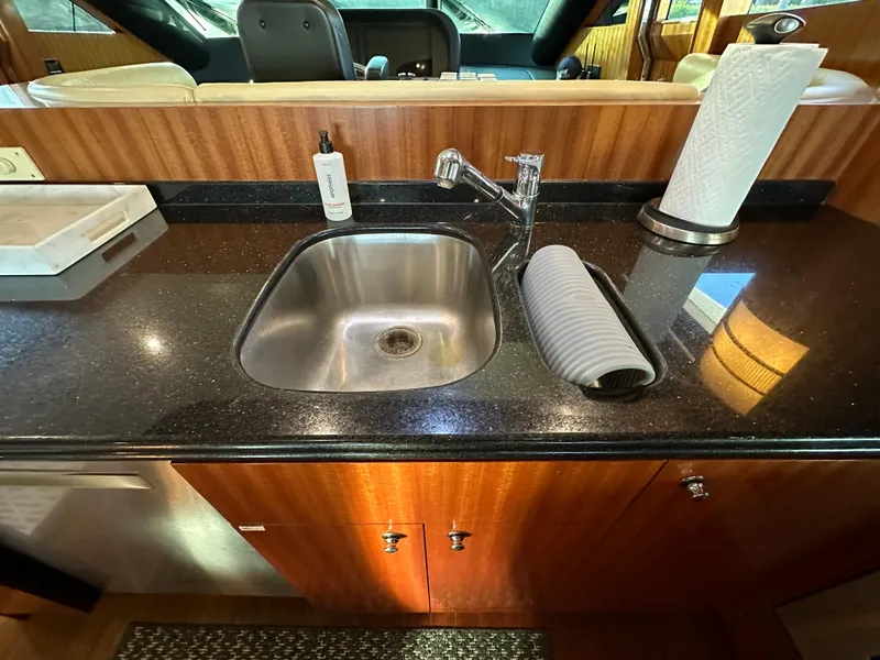 Slide: The Image of Luxurious kitchen sink area on 2007 Horizon 73 Motor Yacht with modern fixtures. - 29