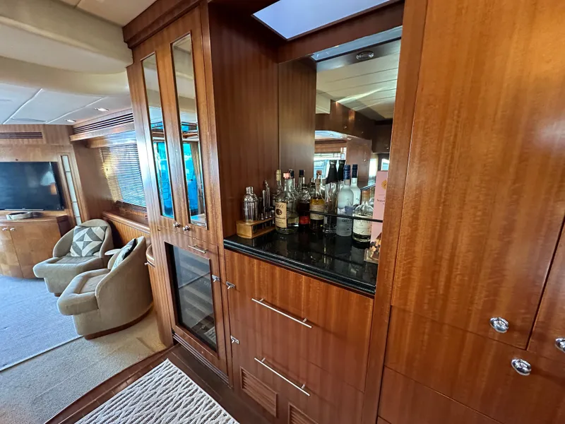 Slide: The Image of Luxurious interior of 2007 Horizon 73 Motor Yacht with elegant wood cabinetry and bar area. - 33