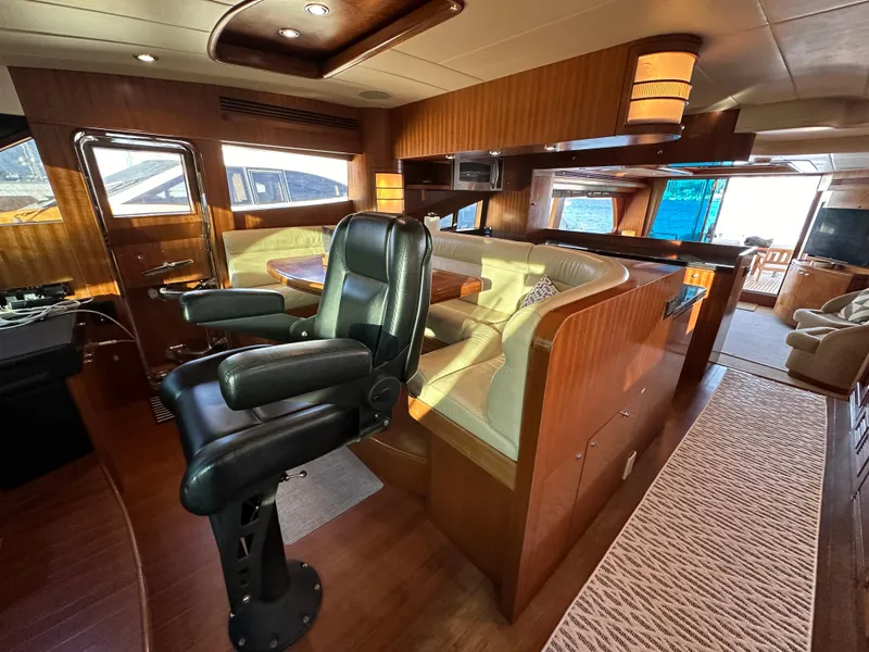 Slide: The Image of Luxurious interior of a 2007 Horizon 73 Motor Yacht with leather seating and wood finishes. - 36
