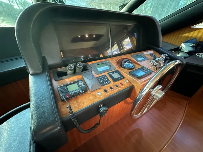 Slide: The Image of 2007 Horizon 73 Motor Yacht helm with navigation instruments and steering wheel. - 39