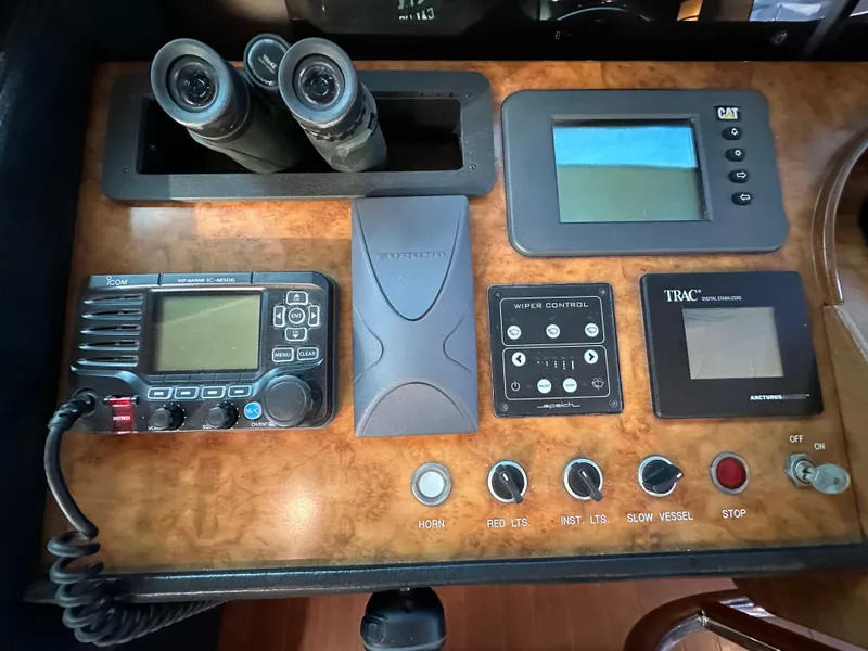 Slide: The Image of Control panel of a 2007 Horizon 73 Motor Yacht with navigation and communication equipment. - 41