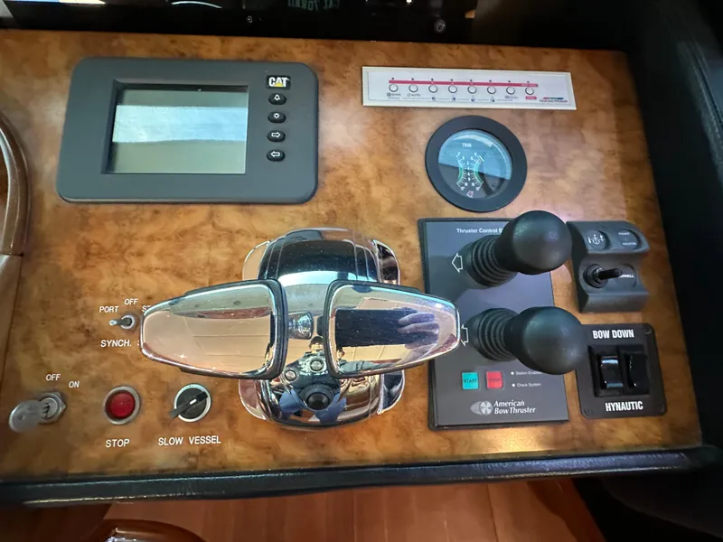 Slide: The Image of Control panel of a 2007 Horizon 73 Motor Yacht with various switches and displays. - 43