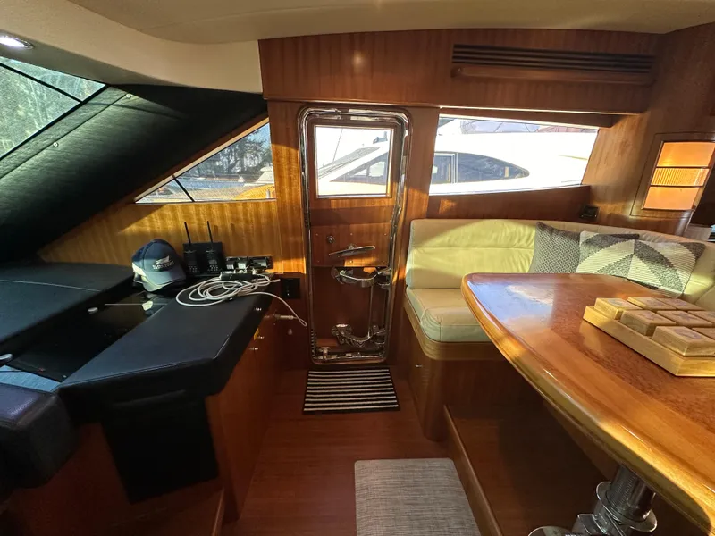 Slide: The Image of Interior of 2007 Horizon 73 Motor Yacht with wood finishes and seating area. - 45