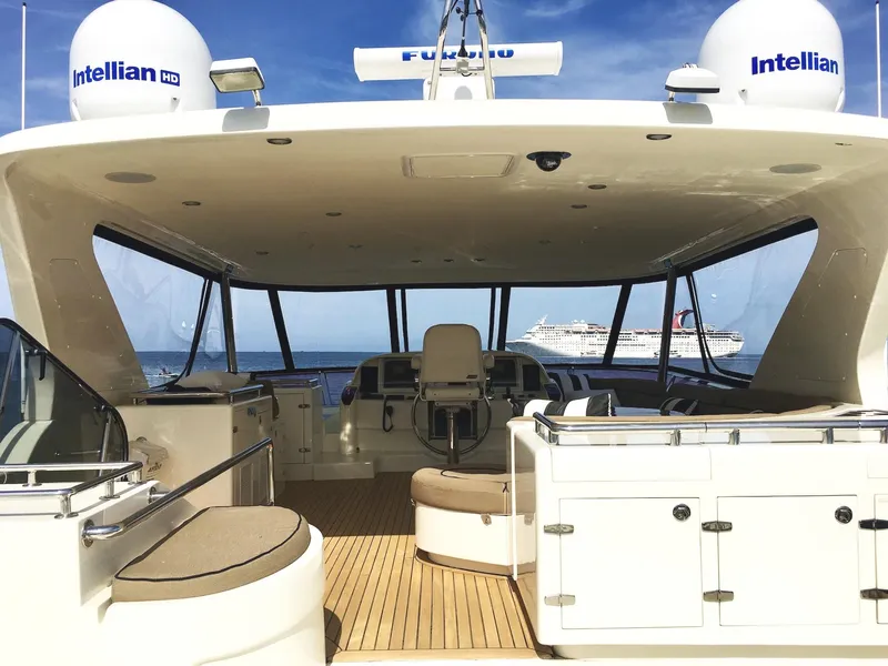 Slide: The Image of Luxurious 2007 Horizon 73 Motor Yacht interior with ocean view and cruise ship in background. - 47