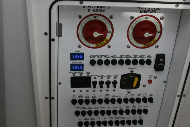 Slide: The Image of Control panel of 2021 Pursuit OS 325 Offshore boat with switches and voltage display. - 21