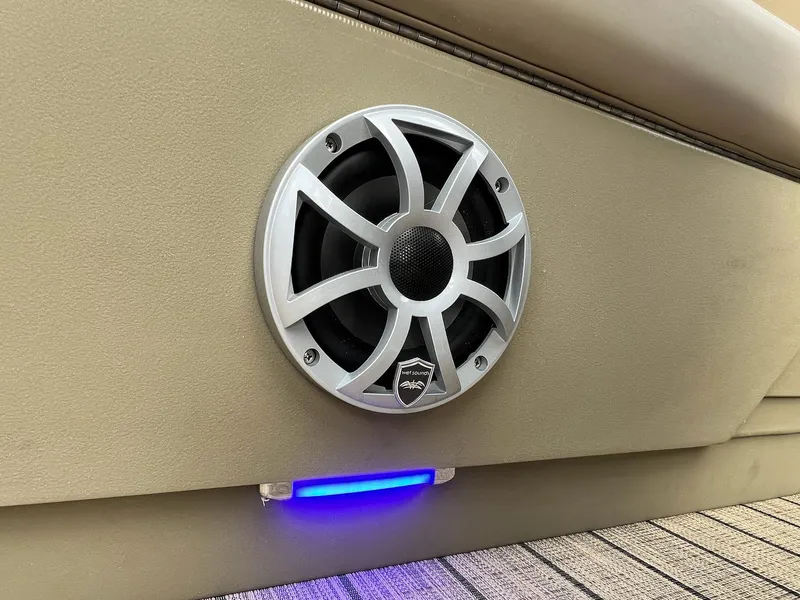 Slide: The Image of Speaker and blue LED light on 2025 Sylvan L3 DLZ Tritoon boat interior. - 16