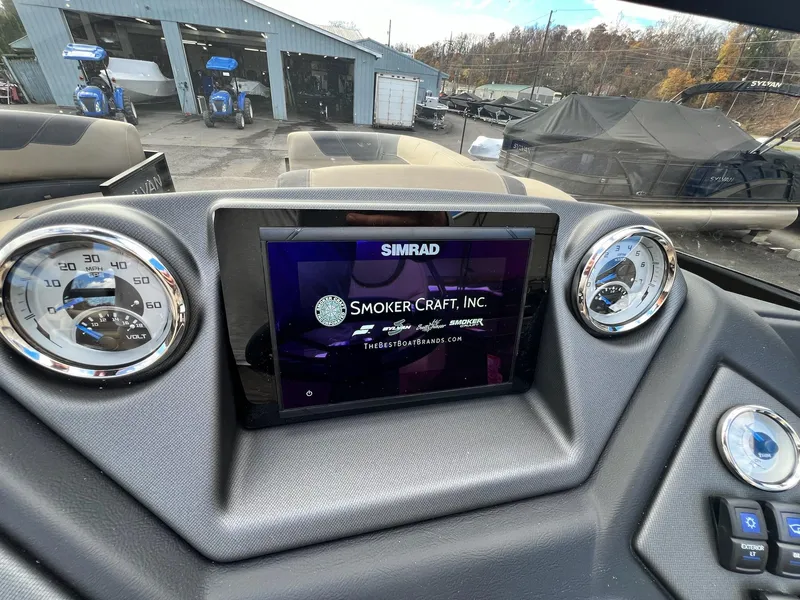 Slide: The Image of Dashboard of 2025 Sylvan L3 DLZ Tritoon with Simrad display and gauges. - 31