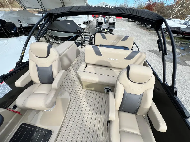 Slide: The Image of 2025 Sylvan L3 DLZ Tritoon interior with beige seating and modern design. - 34