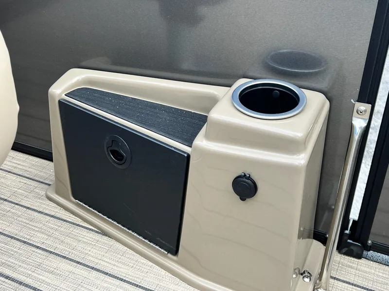 Slide: The Image of 2025 Sylvan L3 DLZ Tritoon cup holder and storage compartment. - 8