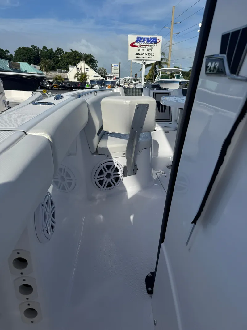 Slide: The Image of 2025 Wellcraft 243 Fisherman boat interior with seating and speakers. - 19