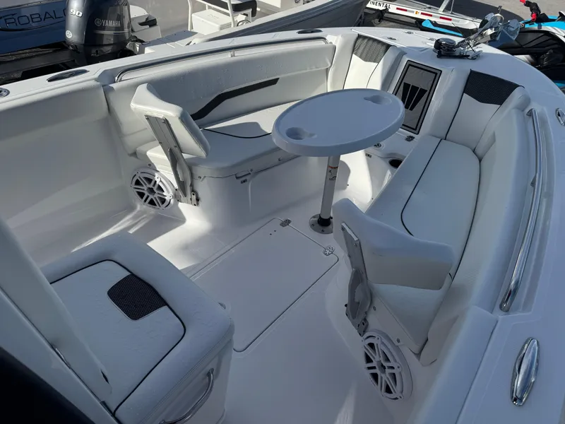 Slide: The Image of 2025 Wellcraft 243 Fisherman boat interior with seating and table. - 21