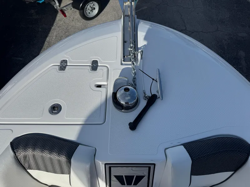 Slide: The Image of 2025 Wellcraft 243 Fisherman boat bow with anchor and deck details. - 23