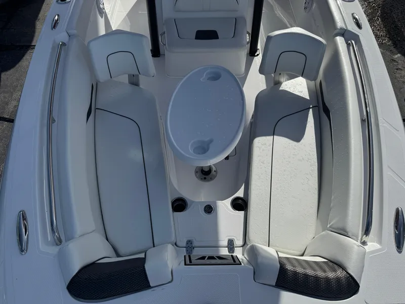 Slide: The Image of 2025 Wellcraft 243 Fisherman boat interior with seating and table. - 24