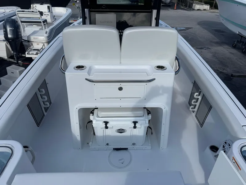 Slide: The Image of 2025 Wellcraft 243 Fisherman boat interior with seating and storage. - 6