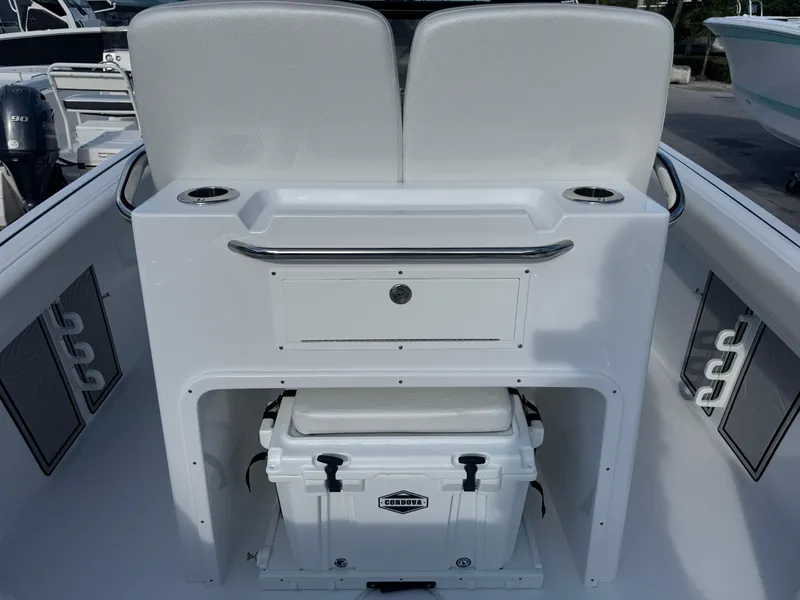 Slide: The Image of 2025 Wellcraft 243 Fisherman boat interior with seating and storage. - 7