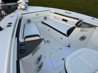 Slide: The Image of 2024 Crevalle 33 CSF boat interior with seating and speakers. - 13